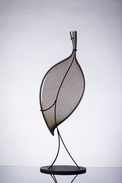 Michael Schunke handblown glass sculpture. Glass leaf, glass canes, striped glass sculpture, studio glass, art glass.