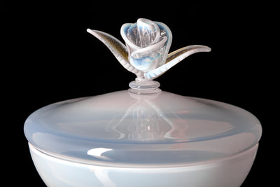 Sacrificial Vessel by Michael Schunke. Handblown glass skull goblet detail. Opaline white glass rose sculpture 