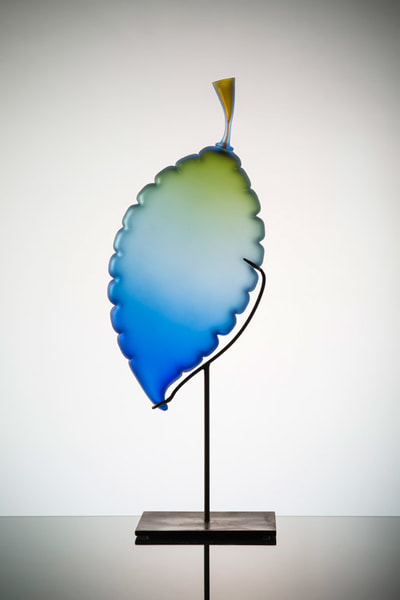 Michael Schunke handblown glass sculpture. Glass leaf, blue glass, blue-green glass sculpture, studio glass, art glass.