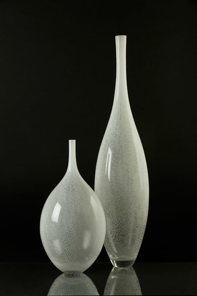 Hand blown glass vessels and sculptural patterned bowls by Michael Schunke and Josie Gluck